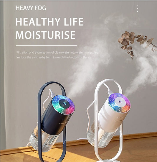 Two humidifiers emitting mist with text about healthy living and moisturizing.
